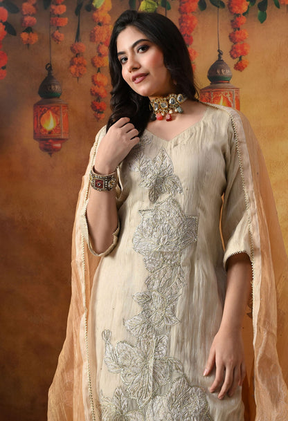 Golden Sharara Set in crust tissue organza with intricate gotta, crystal, and applique work, paired with a golden brown sharara and dupatta