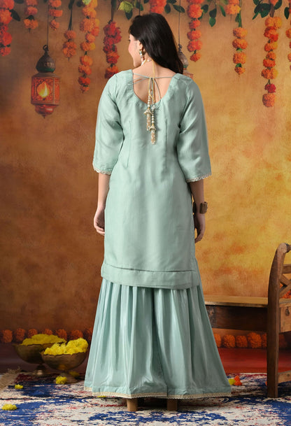 Pistachio Green Gharara Set in crust tissue with intricate gotta, applique, and zardozi work, paired with a contrasting brown dupatta