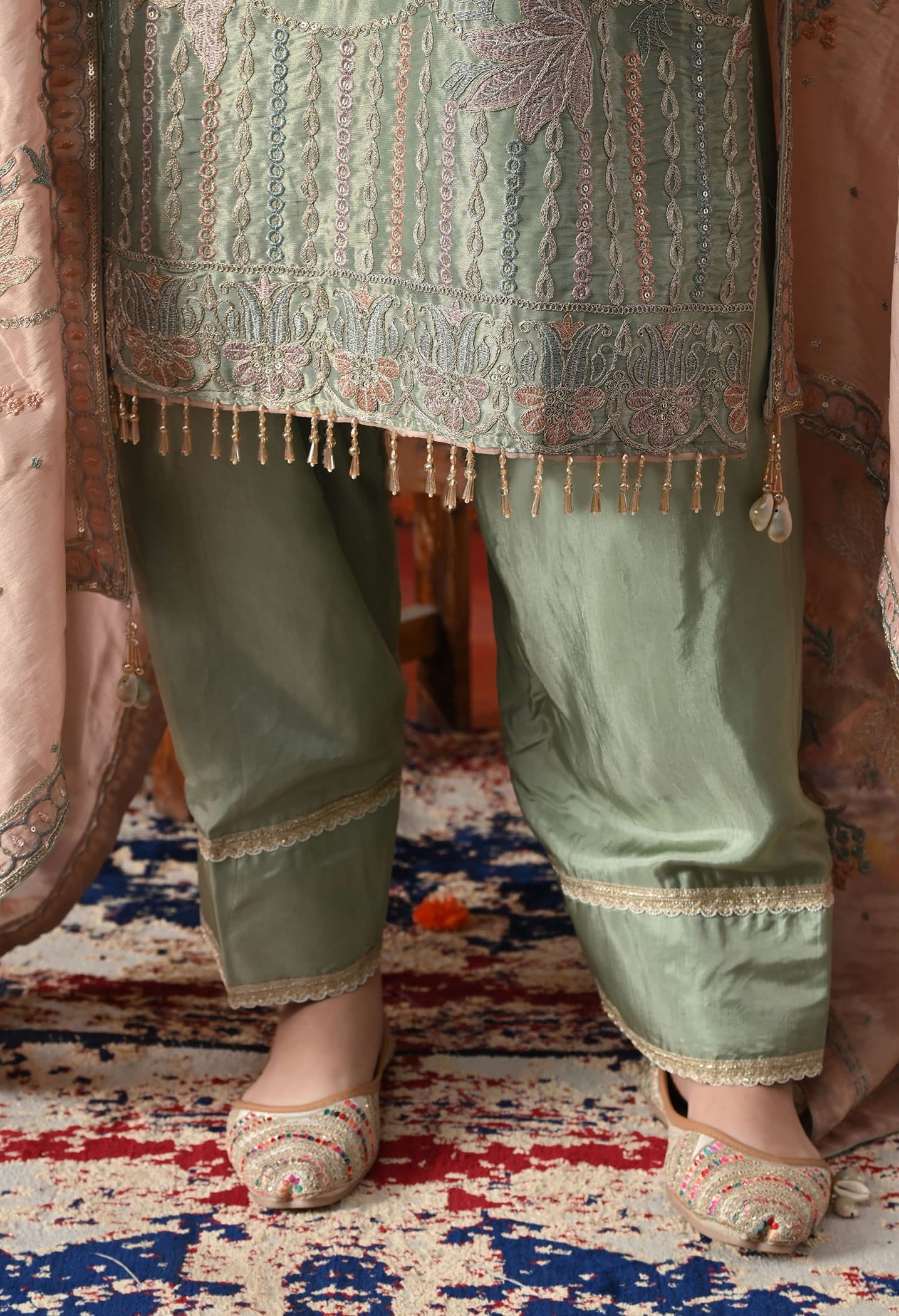 Pistachio Green Tissue Organza Kurta Set with intricate zardozi and sequin work, paired with a peach dupatta and straight pants