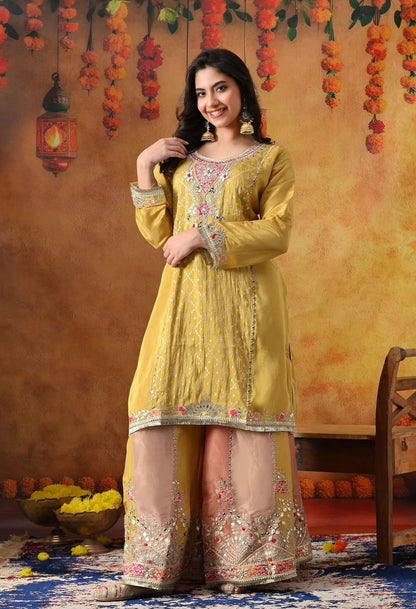 Yellow Tissue Crepe Sharara Set with intricate gotta, zardozi, applique, and thread work, paired with a multicolour sharara and matching dupatta