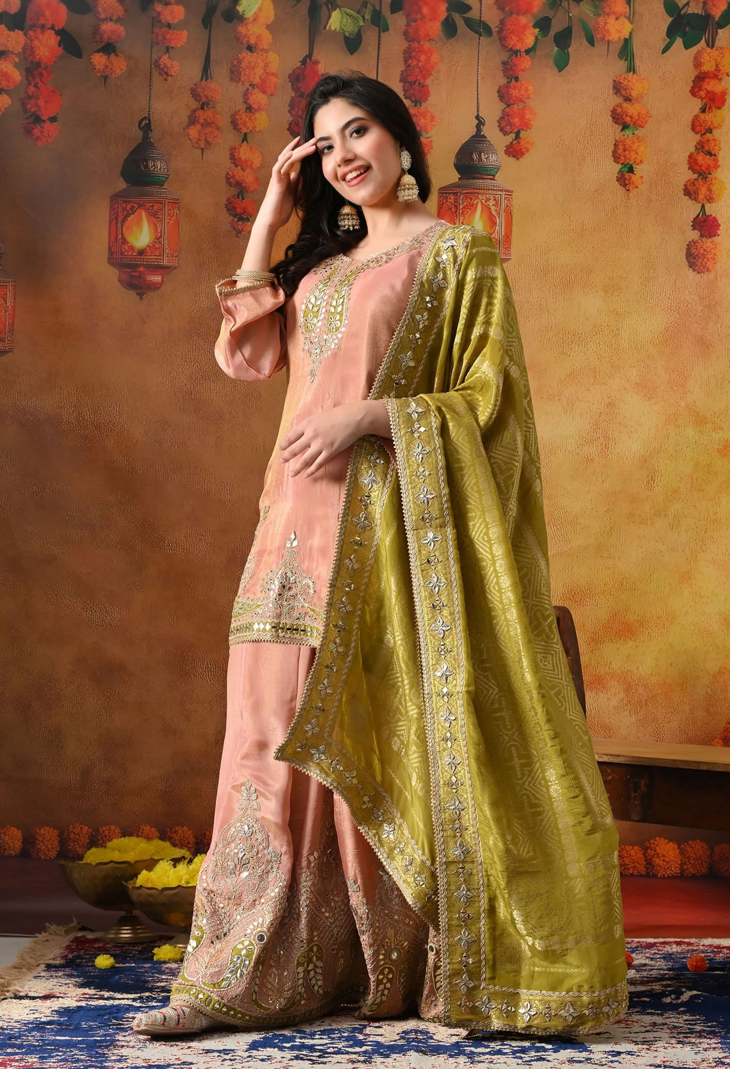 Peach Tissue Crepe Sharara Set with intricate gotta, zardozi, applique, and mirror work, paired with a contrasting green Banarasi silk dupatta