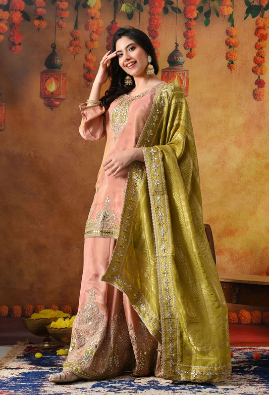 Peach Tissue Crepe Sharara Set with intricate gotta, zardozi, applique, and mirror work, paired with a contrasting green Banarasi silk dupatta