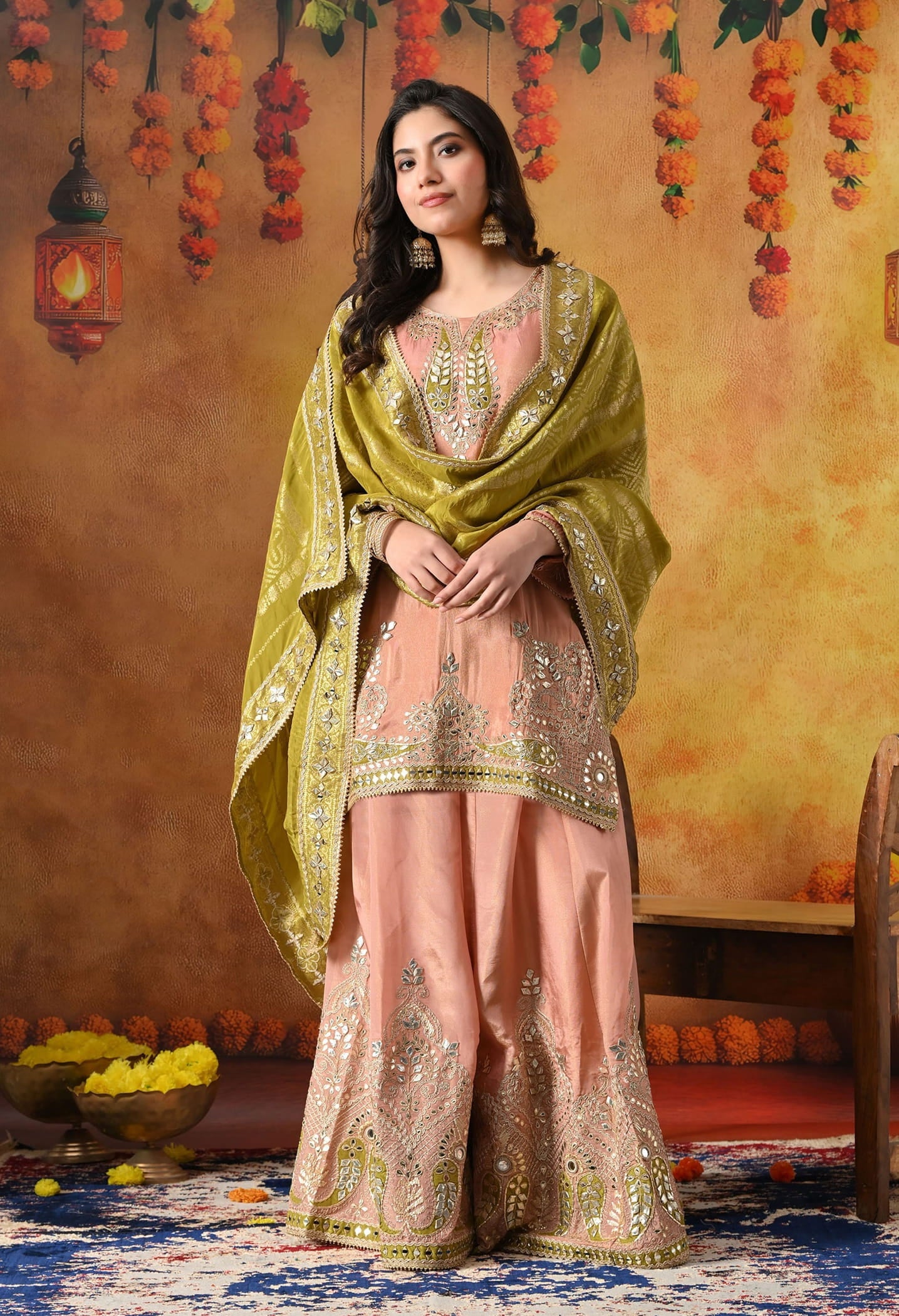 Peach Tissue Crepe Sharara Set with intricate gotta, zardozi, applique, and mirror work, paired with a contrasting green Banarasi silk dupatta