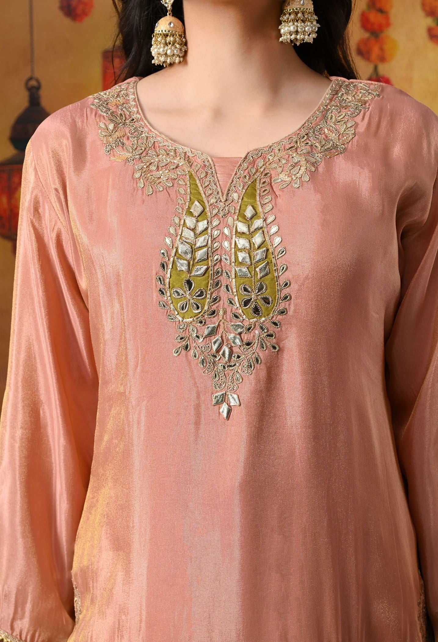 Peach Tissue Crepe Sharara Set with intricate gotta, zardozi, applique, and mirror work, paired with a contrasting green Banarasi silk dupatta