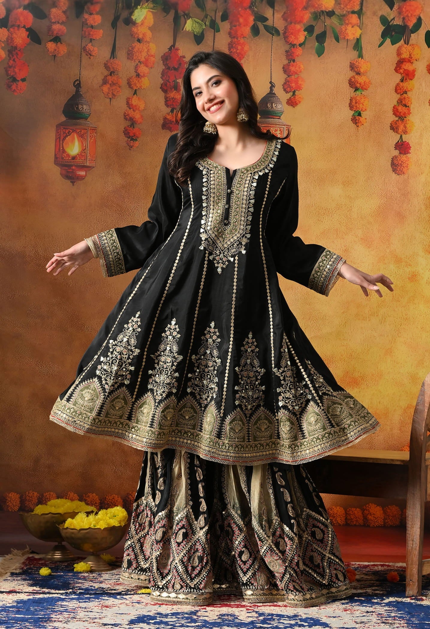 Elegant black gharara set in crepe with gotta, zardozi, and sequin work, paired with a printed gharara and dupatta