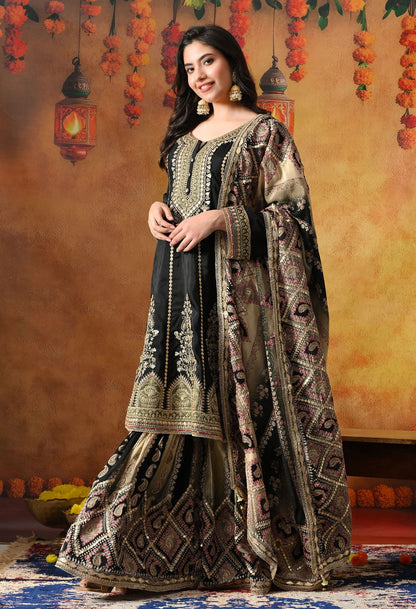 Elegant black gharara set in crepe with gotta, zardozi, and sequin work, paired with a printed gharara and dupatta