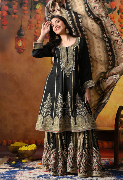 Elegant black gharara set in crepe with gotta, zardozi, and sequin work, paired with a printed gharara and dupatta