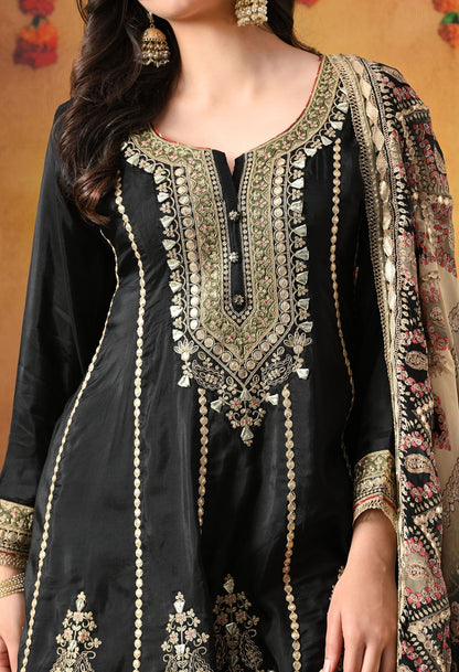 Elegant black gharara set in crepe with gotta, zardozi, and sequin work, paired with a printed gharara and dupatta
