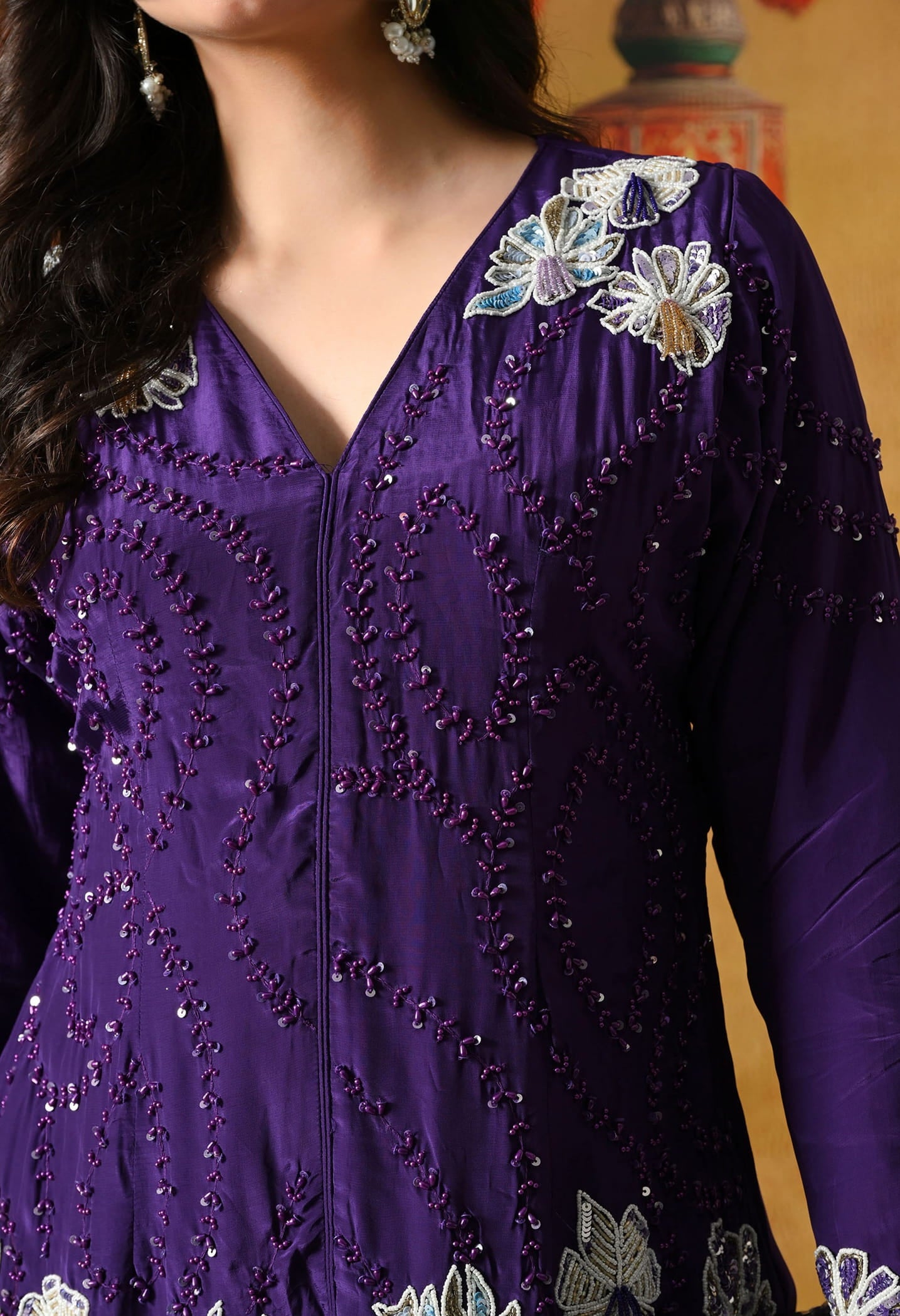 Chic purple indo western set in crepe with sequin, pearl, and cutdana work, paired with a stylish straight palazzo