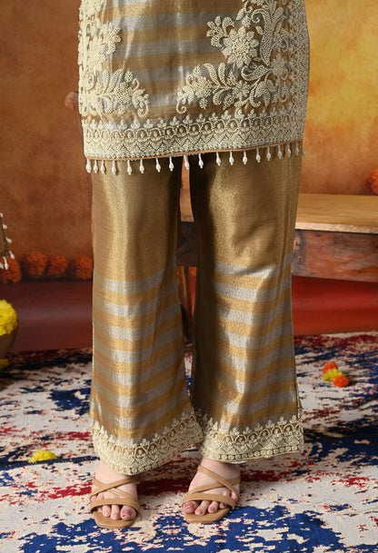 Elegant golden kurta set in tissue silk with thread and pearl work, paired with straight pants and matching dupatta