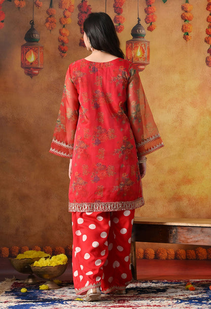 Elegant red kurta set in organza featuring intricate zardozi and sequin work, paired with a graceful farshi salwar and matching dupatta