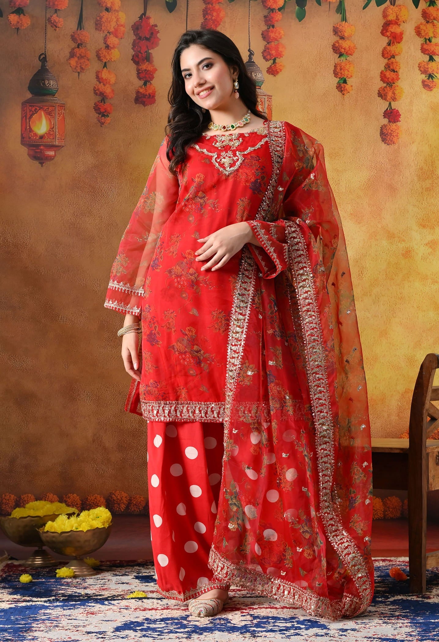 Elegant red kurta set in organza featuring intricate zardozi and sequin work, paired with a graceful farshi salwar and matching dupatta