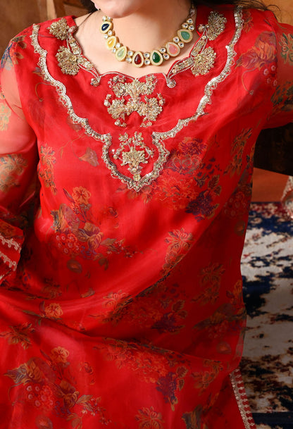 Elegant red kurta set in organza featuring intricate zardozi and sequin work, paired with a graceful farshi salwar and matching dupatta