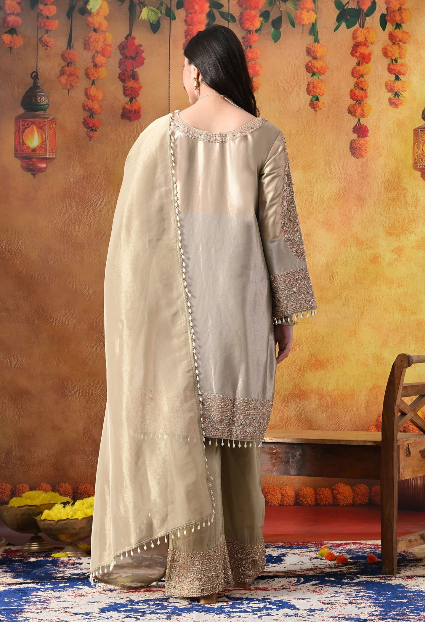 Golden Tissue Silk Kurta Set with intricate thread, pearl, and cutdana work, paired with a tissue organza dupatta and umbrella pants