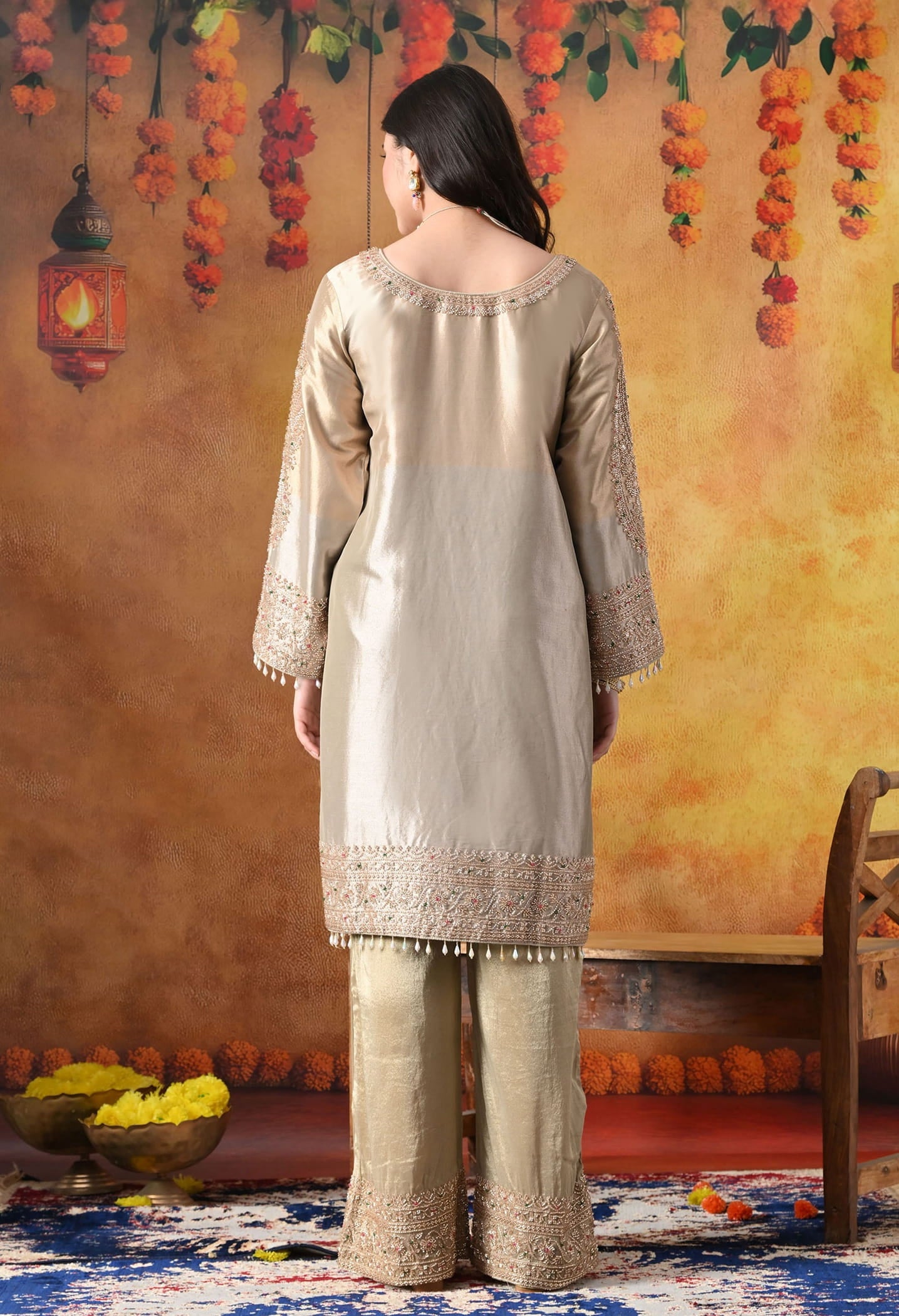 Golden Tissue Silk Kurta Set with intricate thread, pearl, and cutdana work, paired with a tissue organza dupatta and umbrella pants