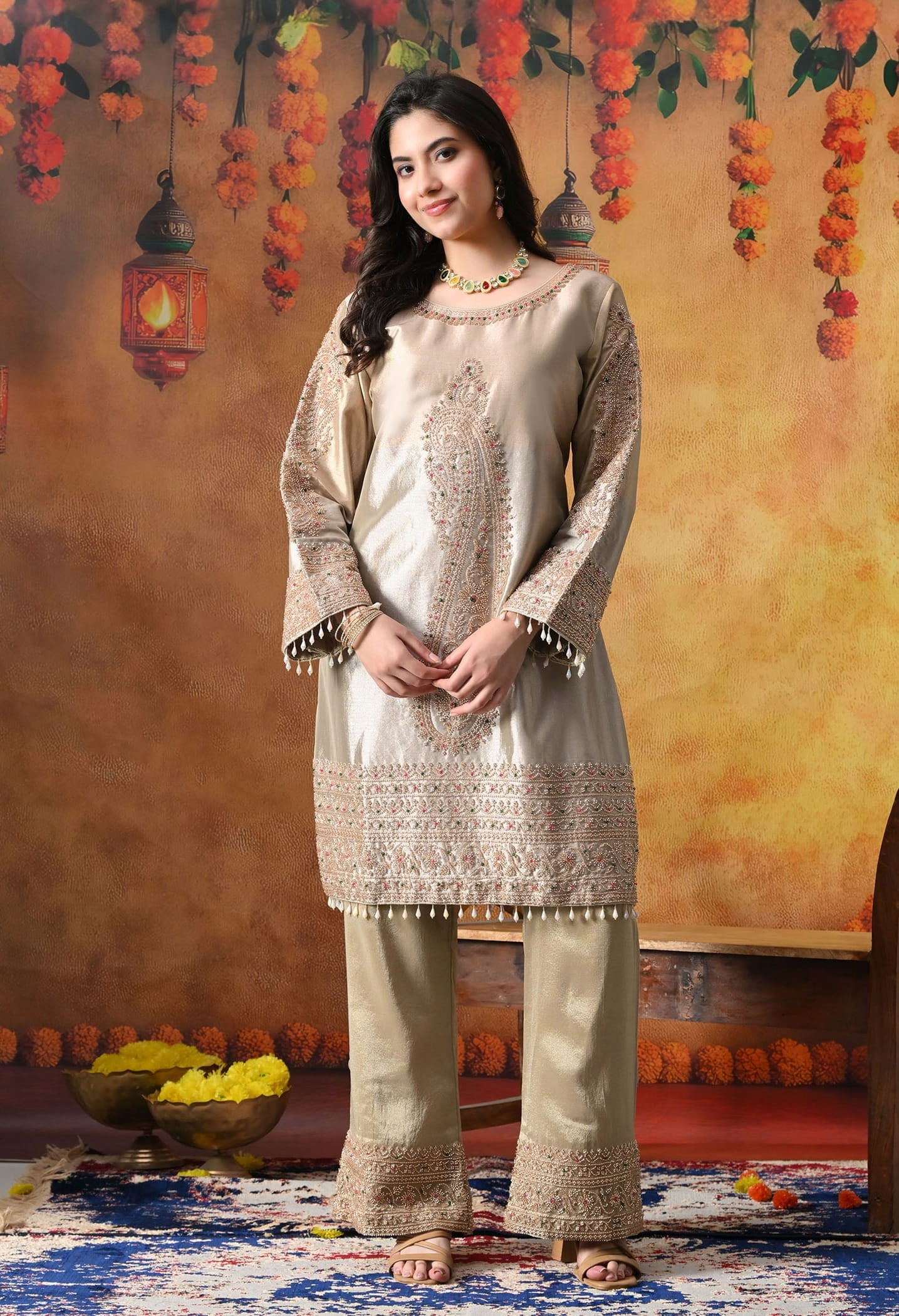 Golden Tissue Silk Kurta Set with intricate thread, pearl, and cutdana work, paired with a tissue organza dupatta and umbrella pants