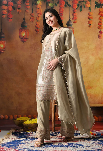 Golden Tissue Silk Kurta Set with intricate thread, pearl, and cutdana work, paired with a tissue organza dupatta and umbrella pants