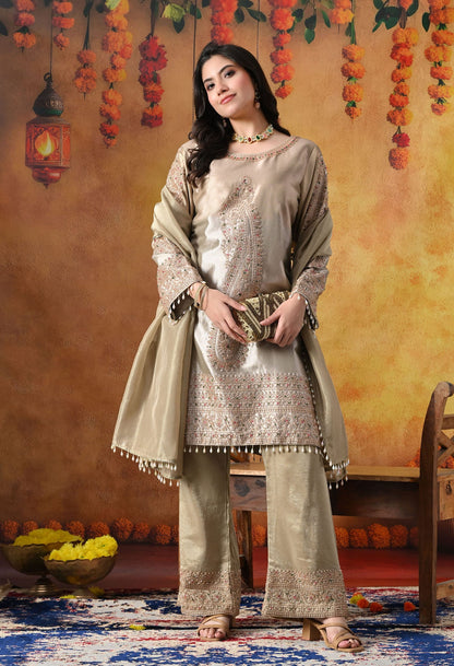 Golden Tissue Silk Kurta Set with intricate thread, pearl, and cutdana work, paired with a tissue organza dupatta and umbrella pants