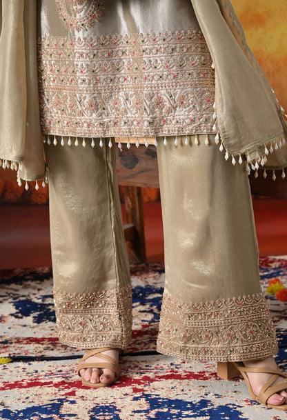 Golden Tissue Silk Kurta Set with intricate thread, pearl, and cutdana work, paired with a tissue organza dupatta and umbrella pants