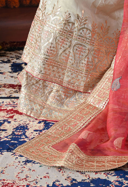 Golden Cream Tissue Crepe Sharara Set with intricate gotta, zardozi, and thread work, paired with a pink tissue organza dupatta