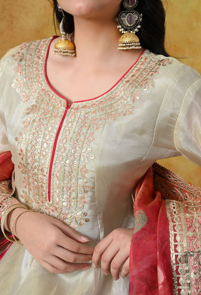 Golden Cream Tissue Crepe Sharara Set with intricate gotta, zardozi, and thread work, paired with a pink tissue organza dupatta