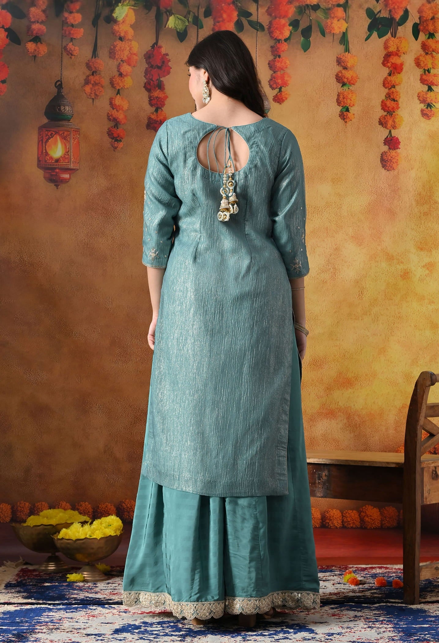 Turquoisesh Blue Sharara Set in crust tissue organza with intricate zardozi, dabka, sequin, and pearl work, paired with a crepe sharara
