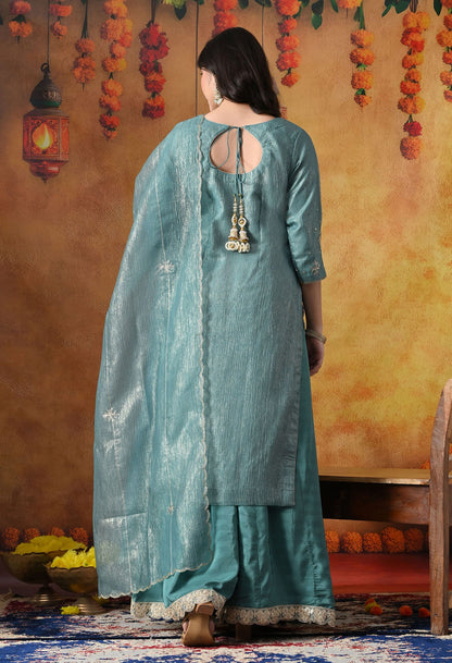 Turquoisesh Blue Sharara Set in crust tissue organza with intricate zardozi, dabka, sequin, and pearl work, paired with a crepe sharara