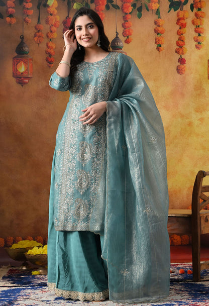 Turquoisesh Blue Sharara Set in crust tissue organza with intricate zardozi, dabka, sequin, and pearl work, paired with a crepe sharara