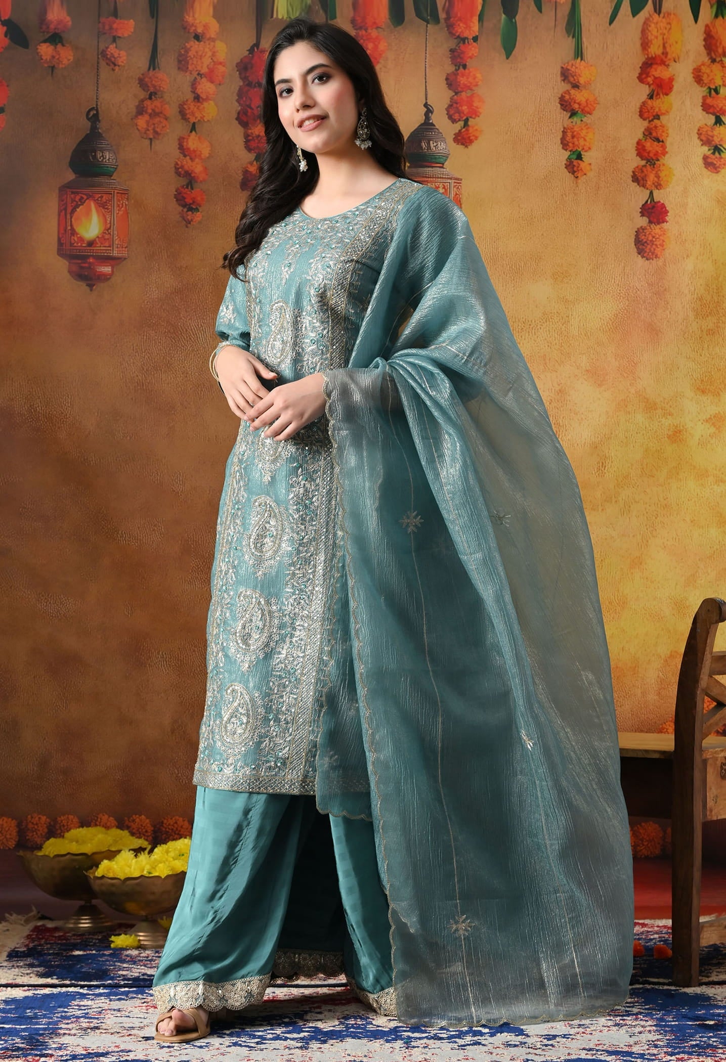Turquoisesh Blue Sharara Set in crust tissue organza with intricate zardozi, dabka, sequin, and pearl work, paired with a crepe sharara