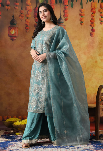 Turquoisesh Blue Sharara Set in crust tissue organza with intricate zardozi, dabka, sequin, and pearl work, paired with a crepe sharara