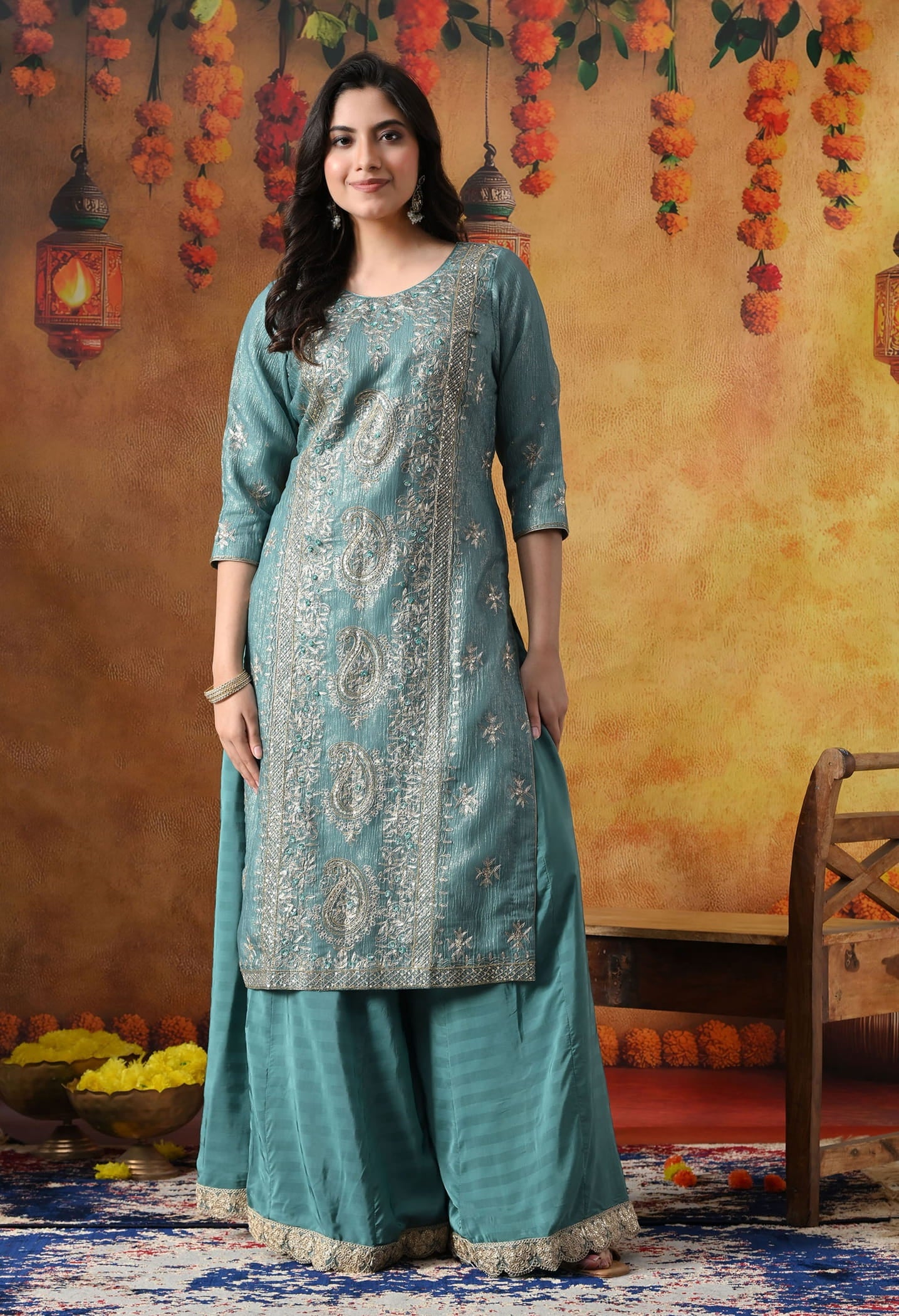 Turquoisesh Blue Sharara Set in crust tissue organza with intricate zardozi, dabka, sequin, and pearl work, paired with a crepe sharara