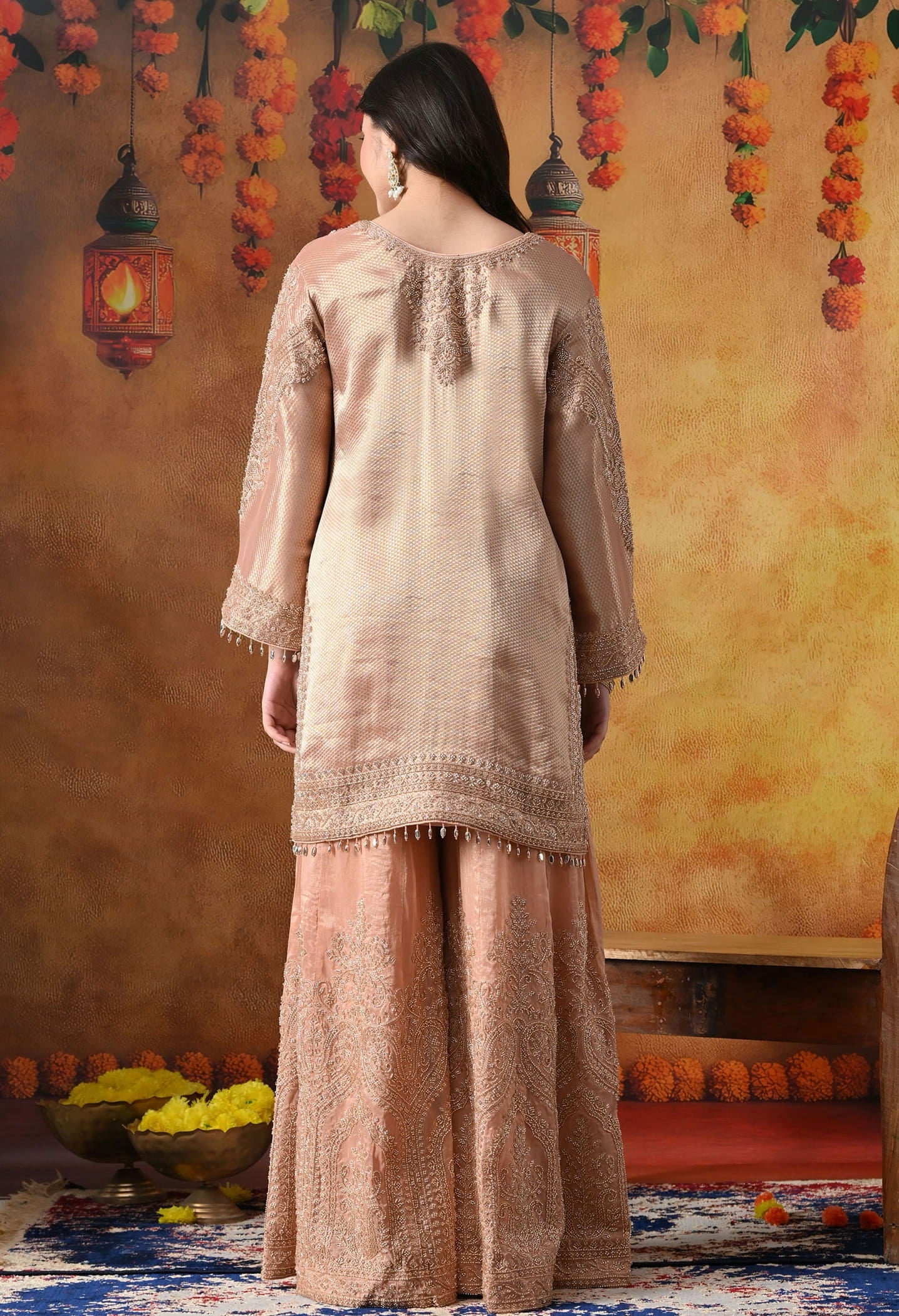 Peach Banarasi Silk Sharara Set with intricate thread, crystal, pearl, and cutdana work, paired with a tissue organza dupatta