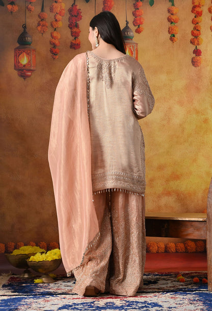 Peach Banarasi Silk Sharara Set with intricate thread, crystal, pearl, and cutdana work, paired with a tissue organza dupatta