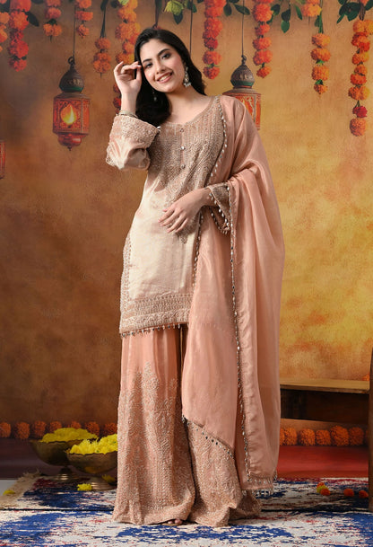 Peach Banarasi Silk Sharara Set with intricate thread, crystal, pearl, and cutdana work, paired with a tissue organza dupatta