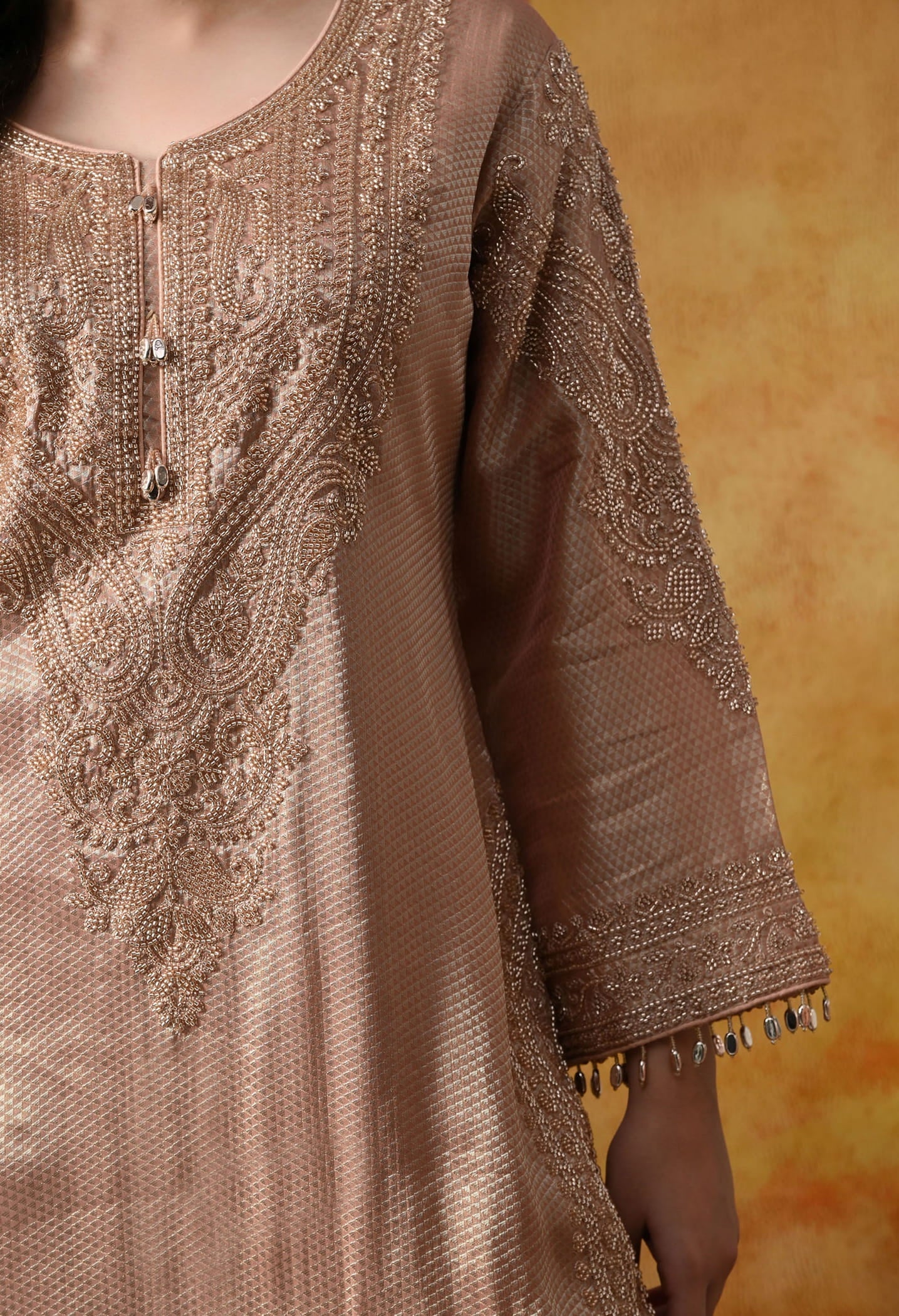 Peach Banarasi Silk Sharara Set with intricate thread, crystal, pearl, and cutdana work, paired with a tissue organza dupatta