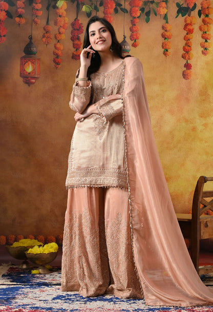 Peach Banarasi Silk Sharara Set with intricate thread, crystal, pearl, and cutdana work, paired with a tissue organza dupatta