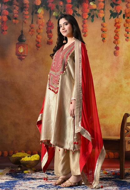 Golden Banarasi Silk Kurta Set with intricate zardozi, pearl, and dabka work, paired with a contrasting red organza dupatta and tissue silk palazzo